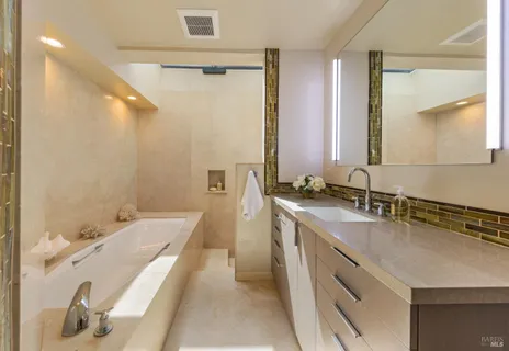 a bathroom with a tub and a sink