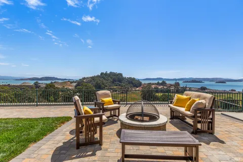 a living room with furniture lamp and a fireplace
