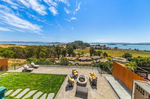 a view of a town with mountains in the background