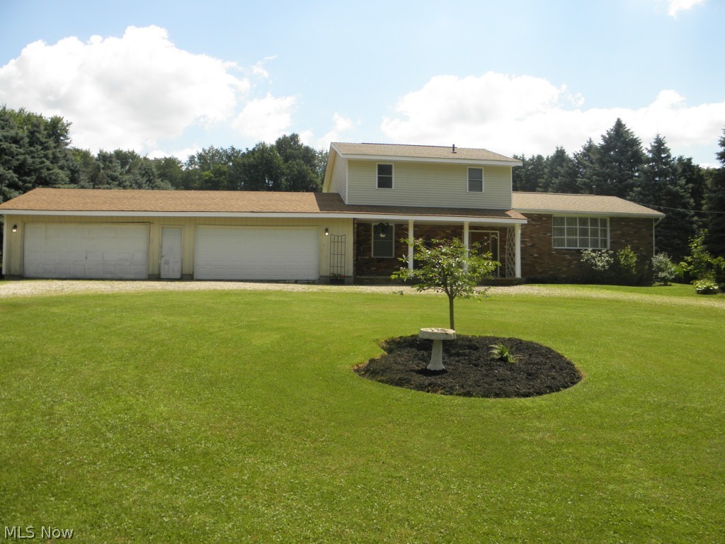 2578 Martin Road Mogadore, OH 44260 - Photo 1 of 25 The front of this home has a U driveway, 4 car garage and front porch perfect for cool summer nights!