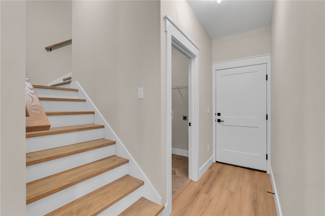 4546 Flat Rock Road Iva, SC 29655 - Photo 20 of 28 This entry area offers a welcoming staircase and convenient access to the laundry.