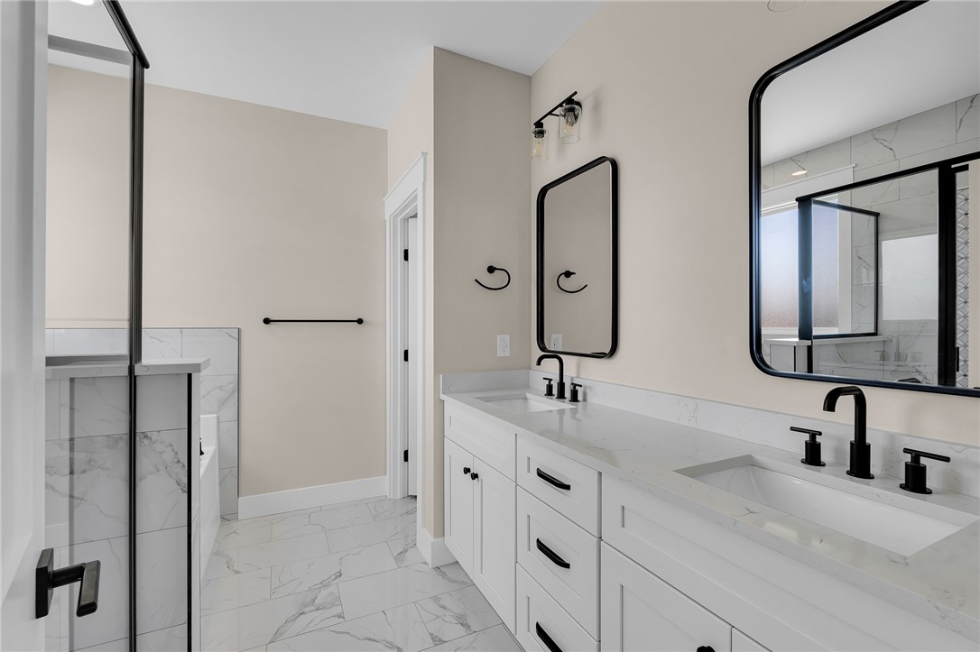 4546 Flat Rock Road Iva, SC 29655 - Photo 24 of 28 This spacious bathroom offers elegant finishes and a serene atmosphere, perfect for daily routines.