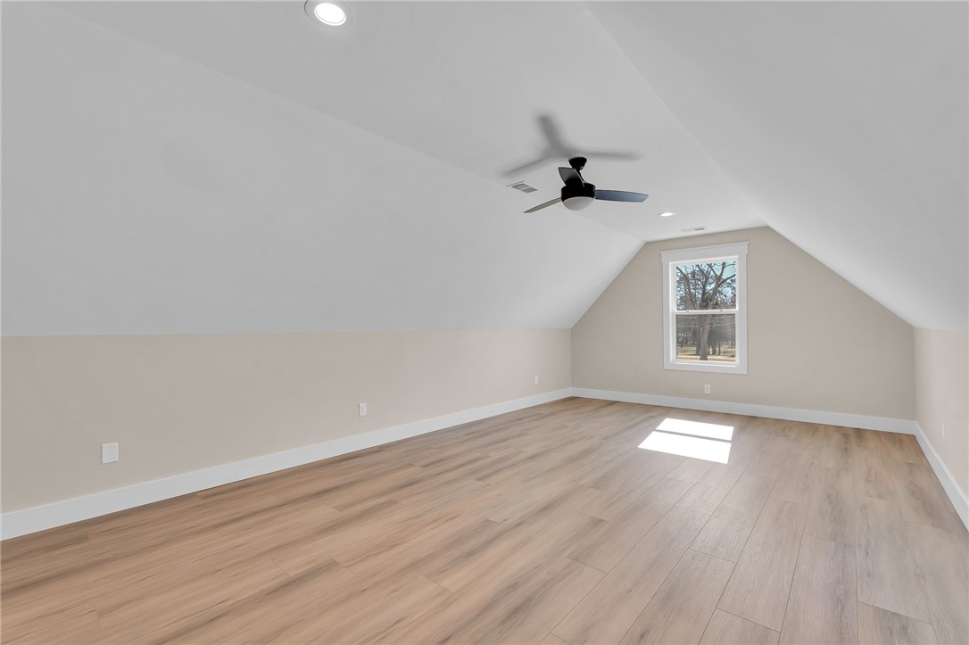 4546 Flat Rock Road Iva, SC 29655 - Photo 26 of 28 This spacious room features vaulted ceilings, providing an airy and open atmosphere.