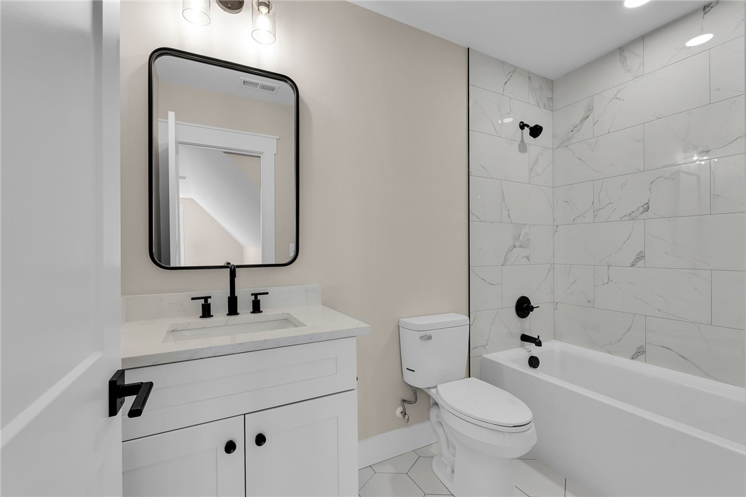 4546 Flat Rock Road Iva, SC 29655 - Photo 28 of 28 This bathroom features contemporary fixtures and crisp tiling, offering a refreshed retreat.