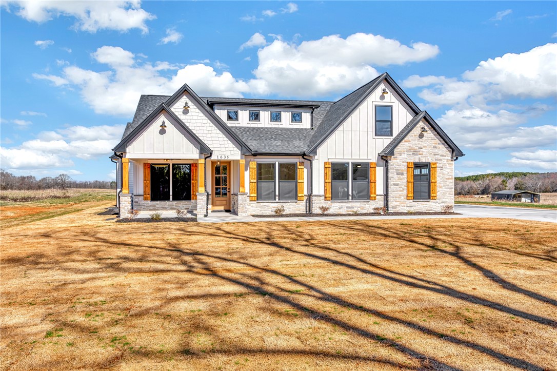 4546 Flat Rock Road Iva, SC 29655 - Photo 3 of 28 This modern farmhouse style home offers charming architectural details and a welcoming facade.