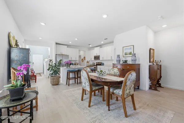 a view of a dining room with furniture and a livingroom