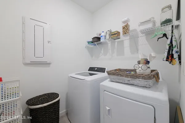 a view of living room with furniture and rug