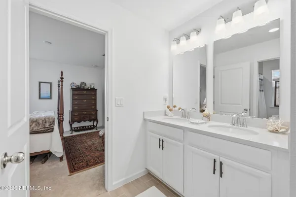 a bathroom with a bathtub a shower and a toilet