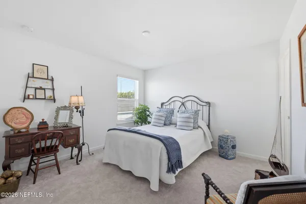 a room with a bed and furniture