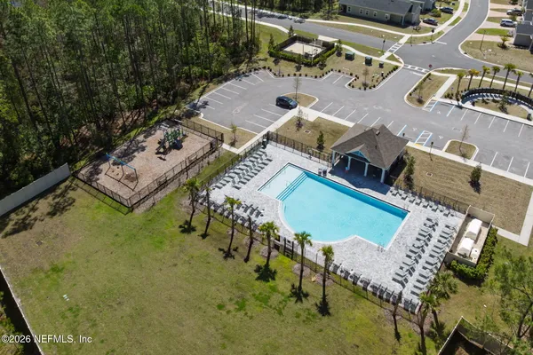 an aerial view of a house with a ocean view