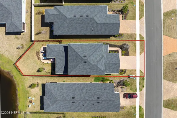 an aerial view of a house with a garden and plants