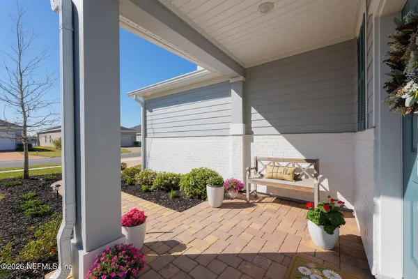 a balcony view with a potted plant