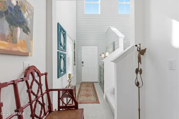 a view of an entryway with wooden floor