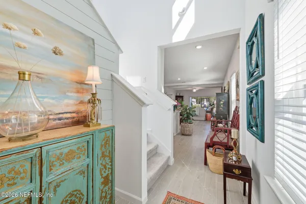 a view of an entryway with wooden floor