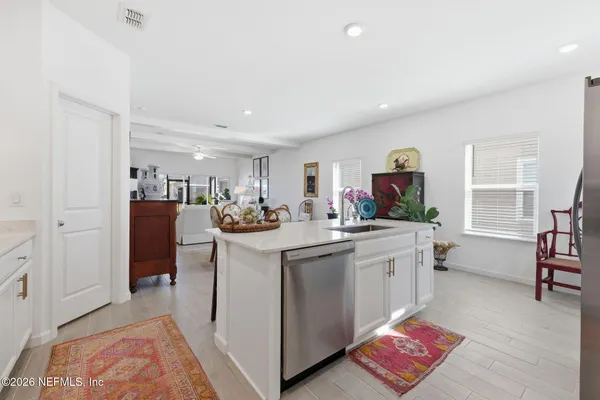 a kitchen with sink and cabinets