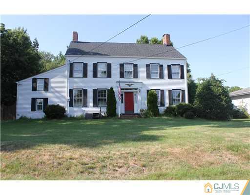 972 New Dover Road Edison, NJ 08820 - Photo 1 of 20 a front view of a house with a garden