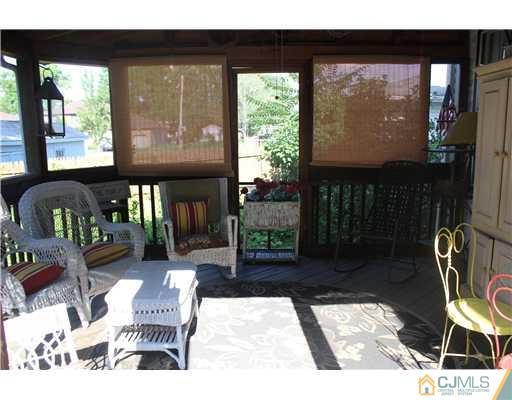 972 New Dover Road Edison, NJ 08820 - Photo 11 of 20 a view of a porch with furniture and garden