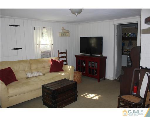 972 New Dover Road Edison, NJ 08820 - Photo 7 of 20 a living room with furniture and a flat screen tv
