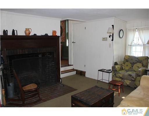 972 New Dover Road Edison, NJ 08820 - Photo 8 of 20 a living room with furniture and a fireplace