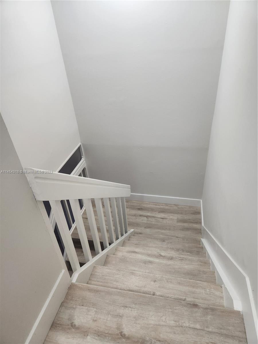 7753 Courtyard Run West, Unit 7753 Boca Raton, FL 33433 - Photo 8 of 15 a view of wooden floor