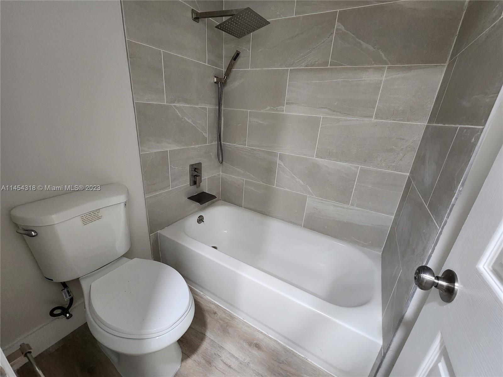 7753 Courtyard Run West, Unit 7753 Boca Raton, FL 33433 - Photo 10 of 15 a bathroom with a toilet and a bathtub