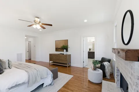 a bedroom with bed and a couch