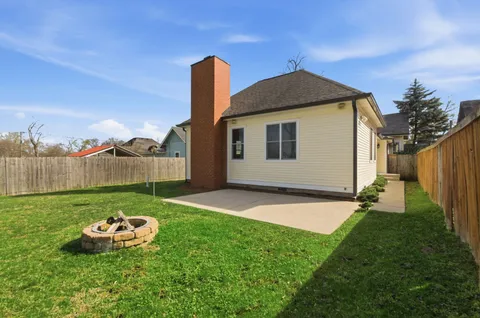 a backyard of a house with lots of green space