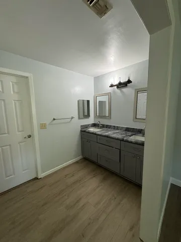 a kitchen with a sink and cabinets