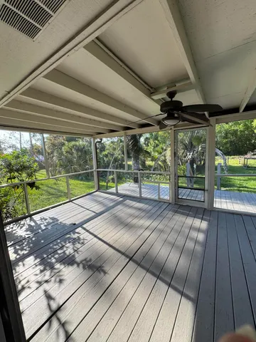 a view of outdoor space with wooden floor and yard