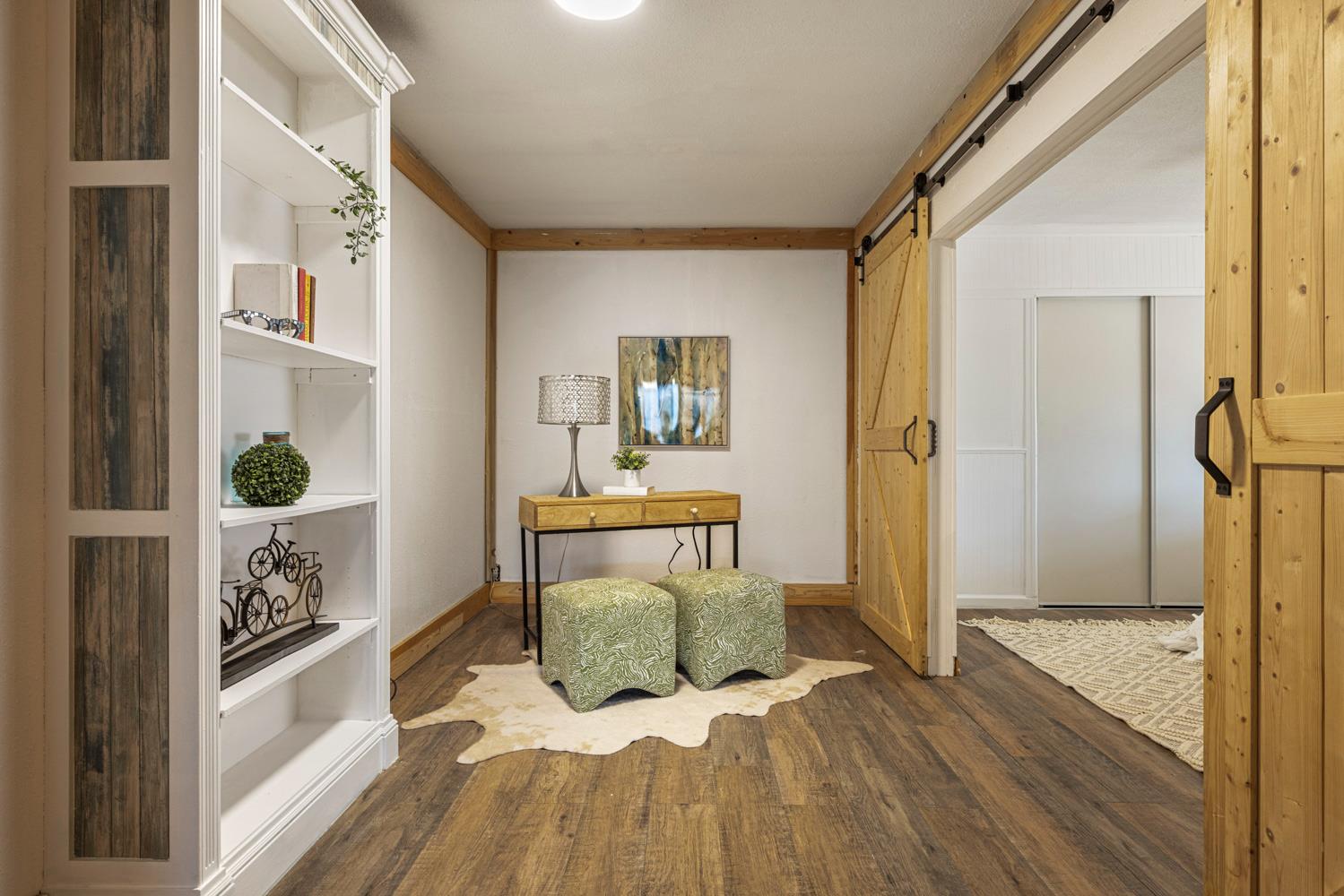 2621 Prescott Road, Unit 79 Modesto, CA 95350 - Photo 30 of 41 a view of a hallway with wooden floor and a living room