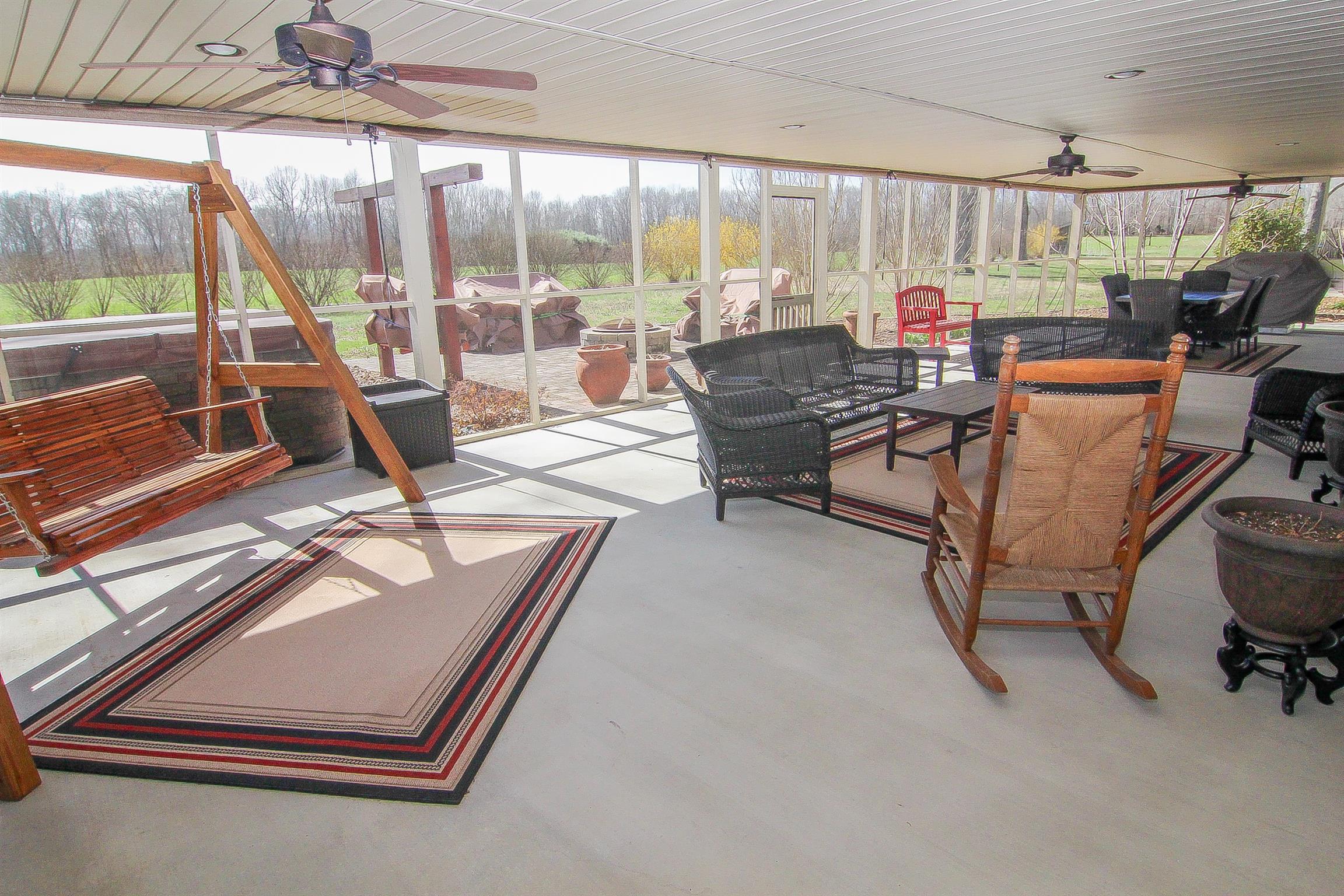 3989 Spring Creek Road Estill Springs, TN 37330 - Photo 11 of 28 A screened in porch overlooks the property