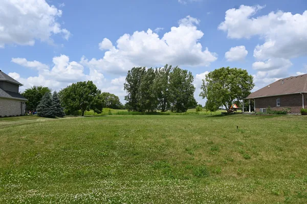 a backyard of a house with lots of green space