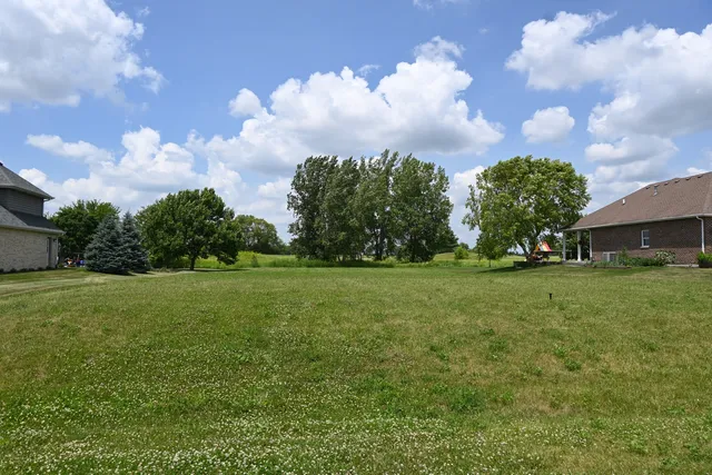 a backyard of a house with lots of green space