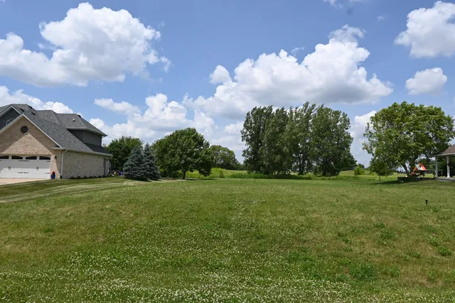 a view of a big yard with a house