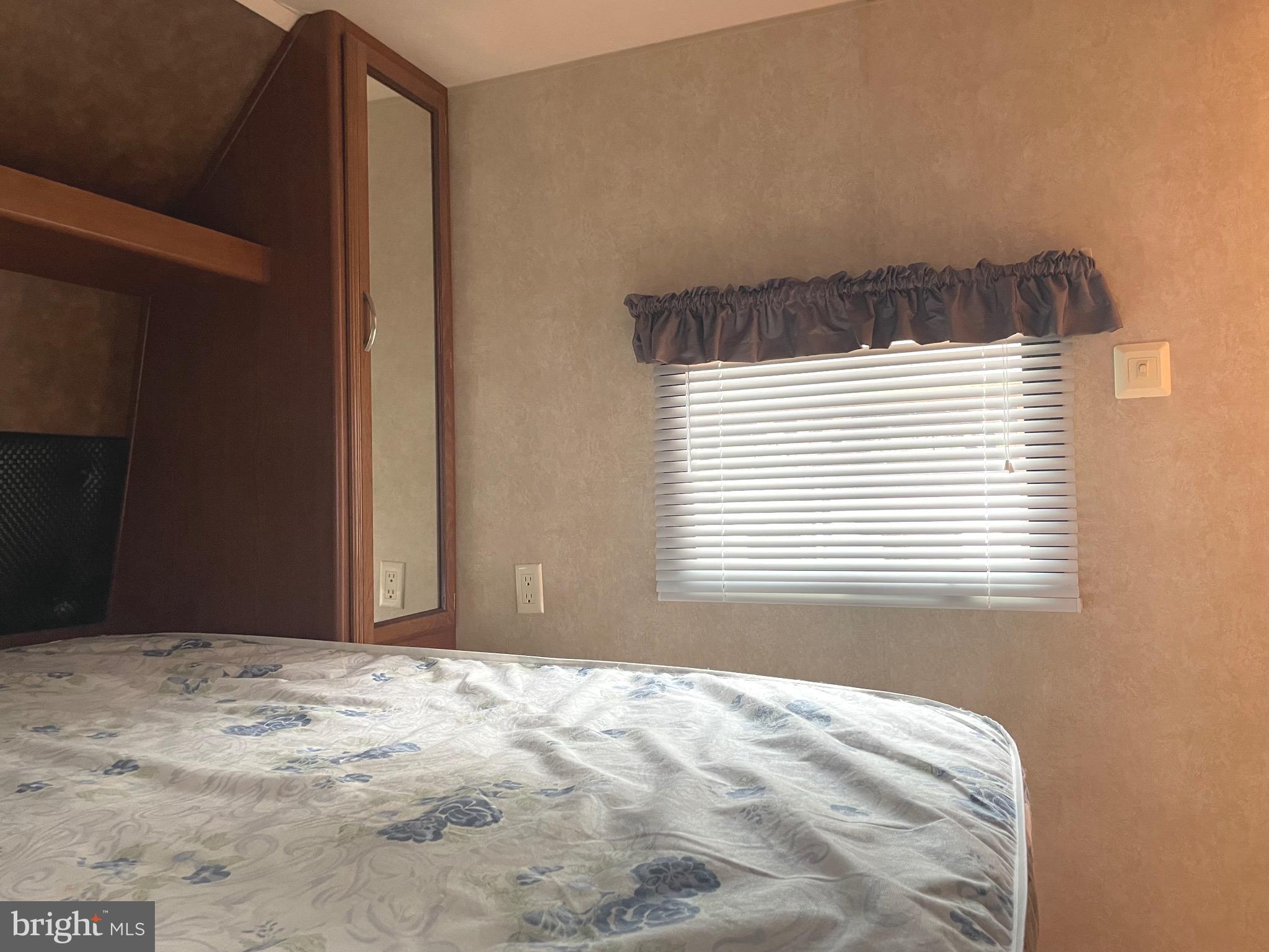 52 Block Butterfly Boulevard Falling Waters, WV 25419 - Photo 11 of 23 a view of a bedroom with a window