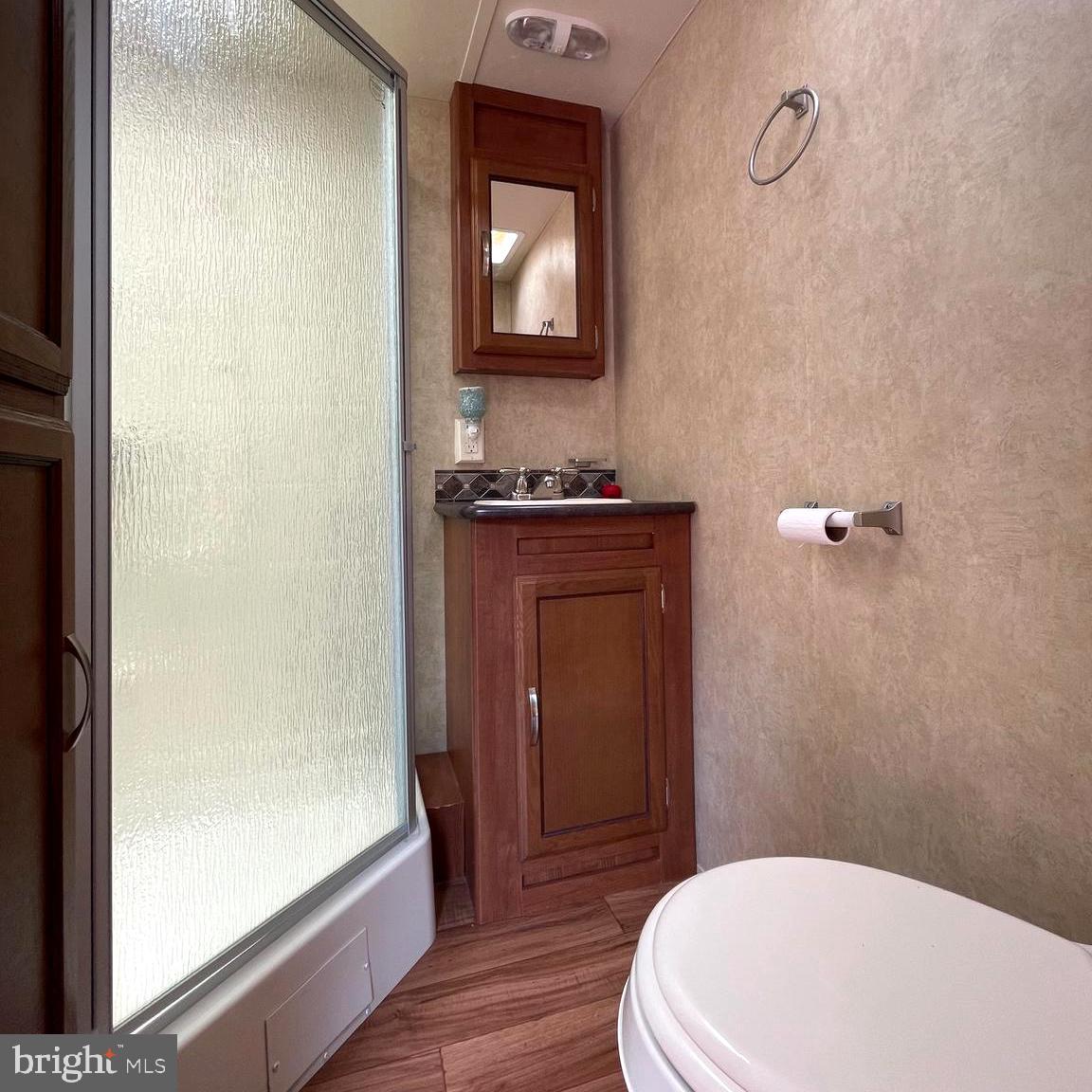 52 Block Butterfly Boulevard Falling Waters, WV 25419 - Photo 15 of 23 a bathroom with a sink a toilet and shower