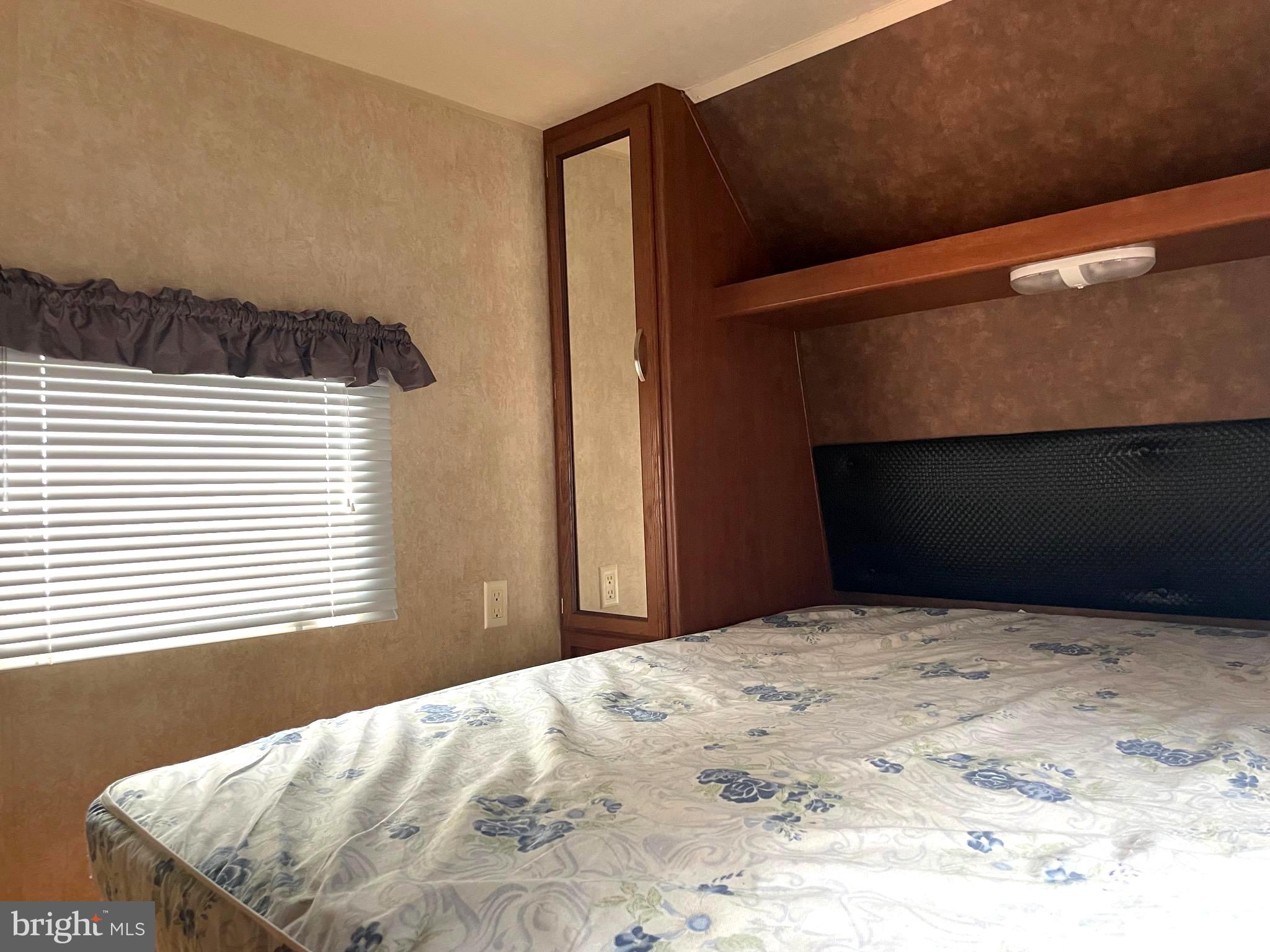 52 Block Butterfly Boulevard Falling Waters, WV 25419 - Photo 10 of 23 a bedroom with a bed and a window