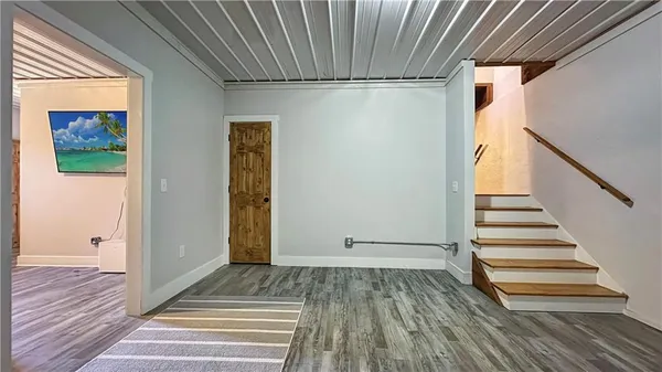 a view of a entryway door with wooden floor