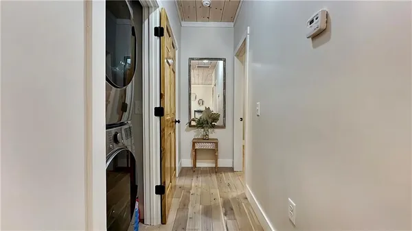 a bedroom with a bed and a mirror