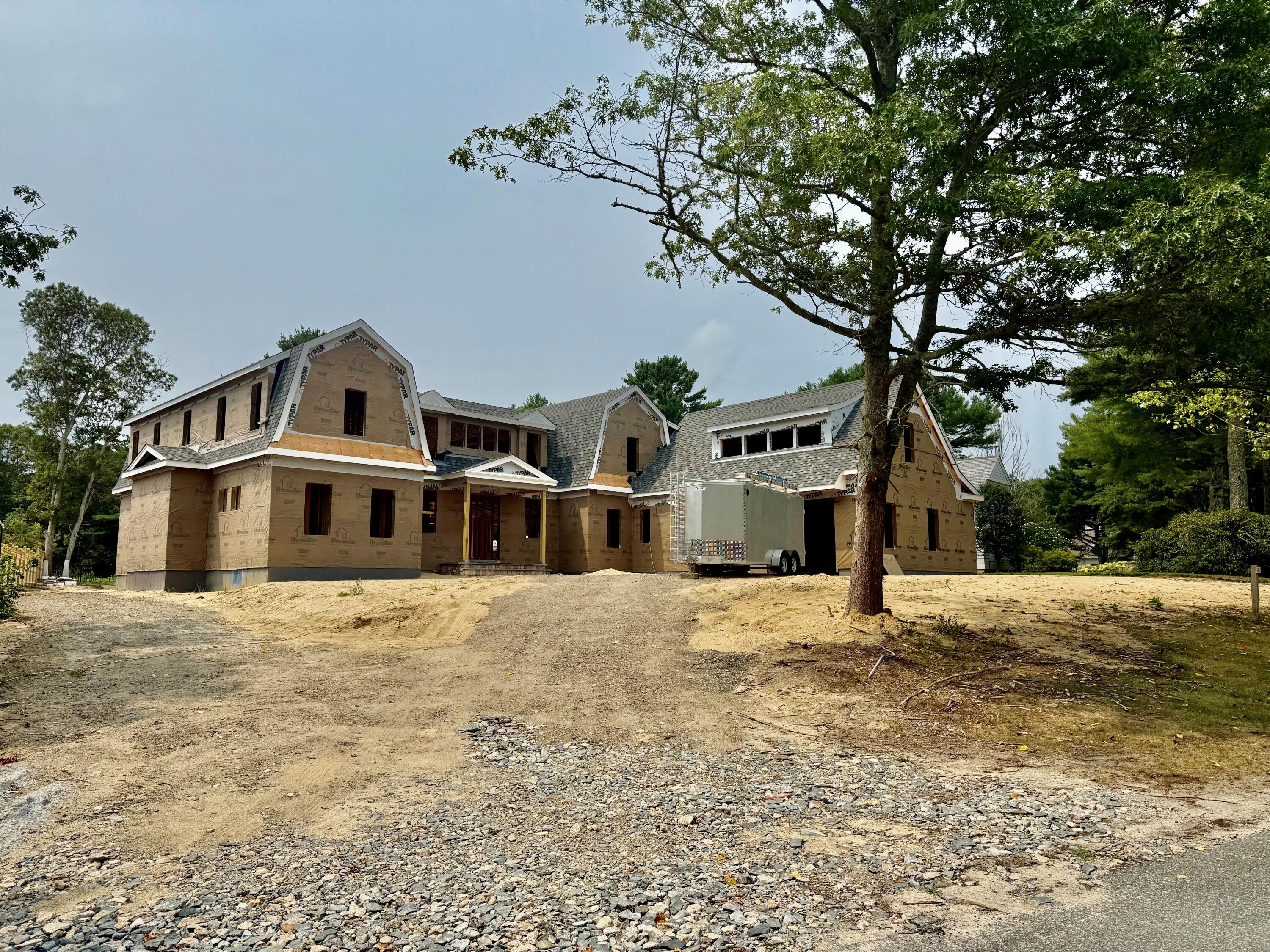 226 Dun Robin Road Mashpee, MA 02649 - Photo 3 of 7 a front view of a house with a yard
