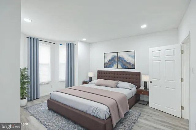 a view of hallway with wooden floor