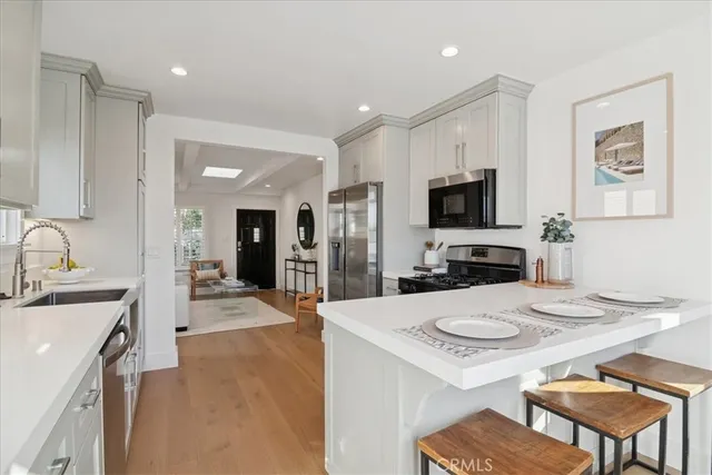 a bedroom with a bed and a large mirror