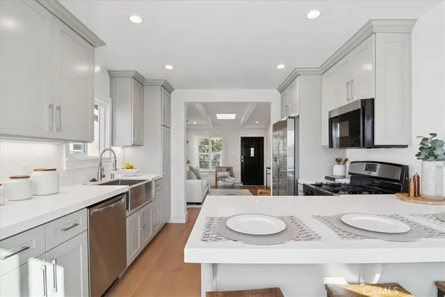 a bathroom with a shower a sink and a mirror