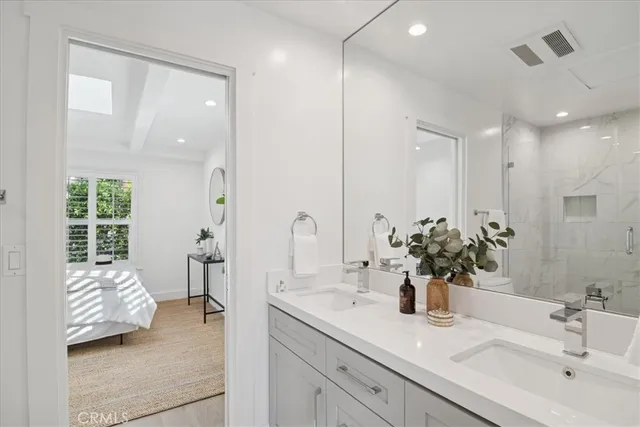 a view of a patio with couches table and chairs with wooden floor and fence