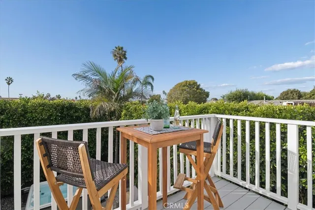 a kitchen with appliances a refrigerator and a sink