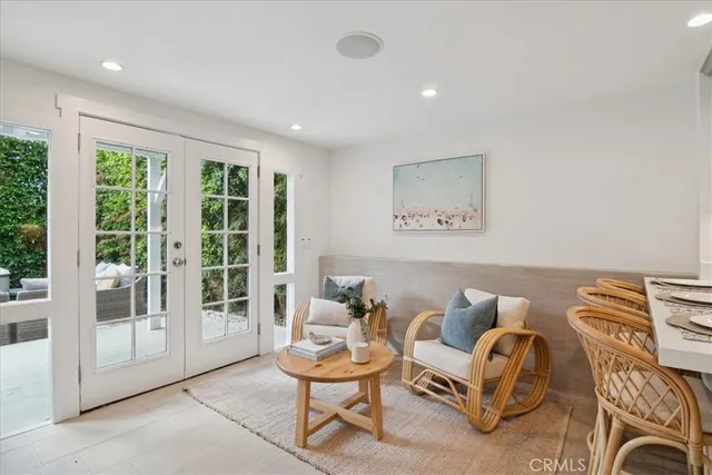 a room with a table chairs and a fireplace