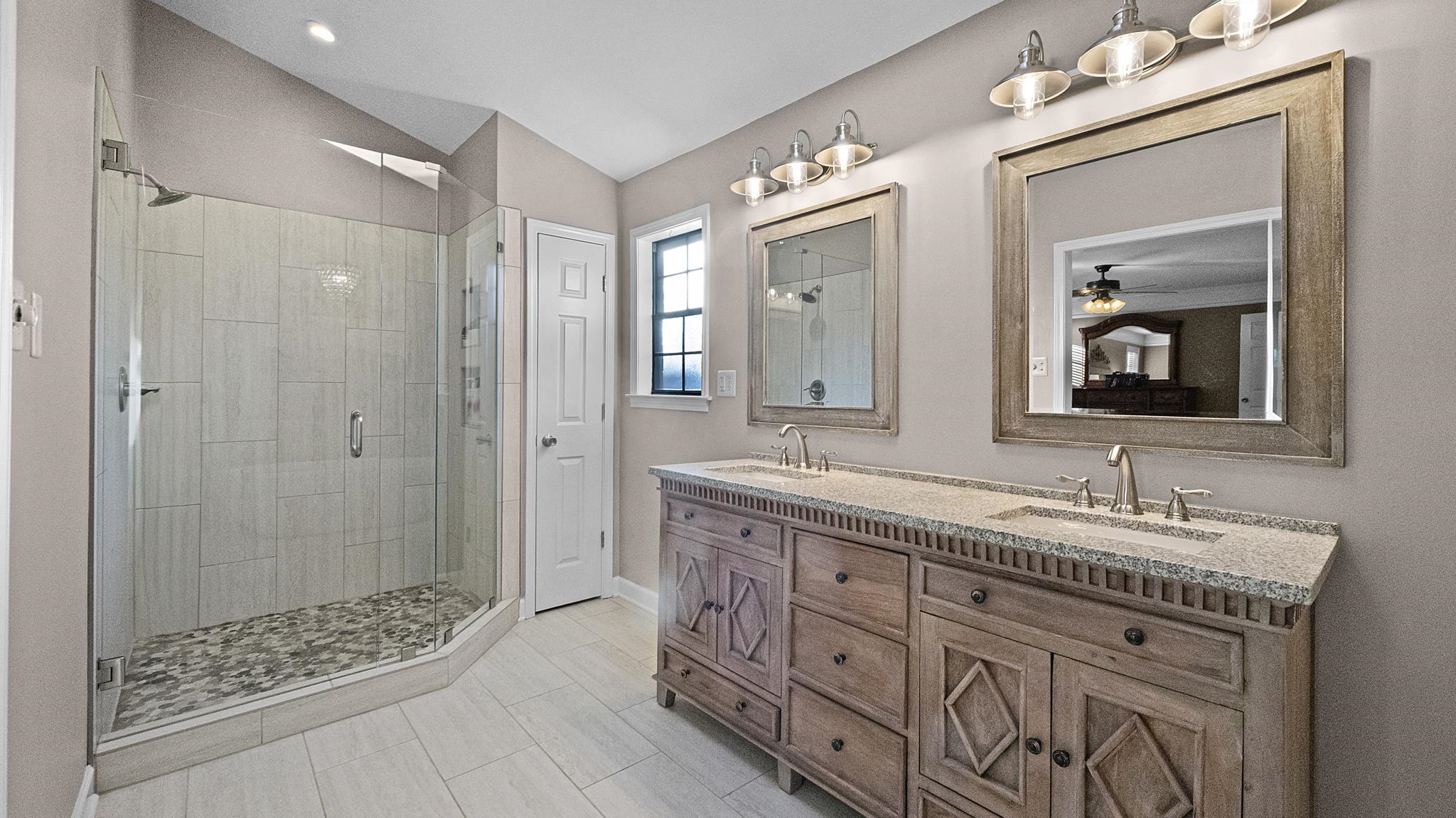 1883 Edwards Mill Road Germantown, TN 38139 - Photo 11 of 40 a bathroom with double sink and a mirror