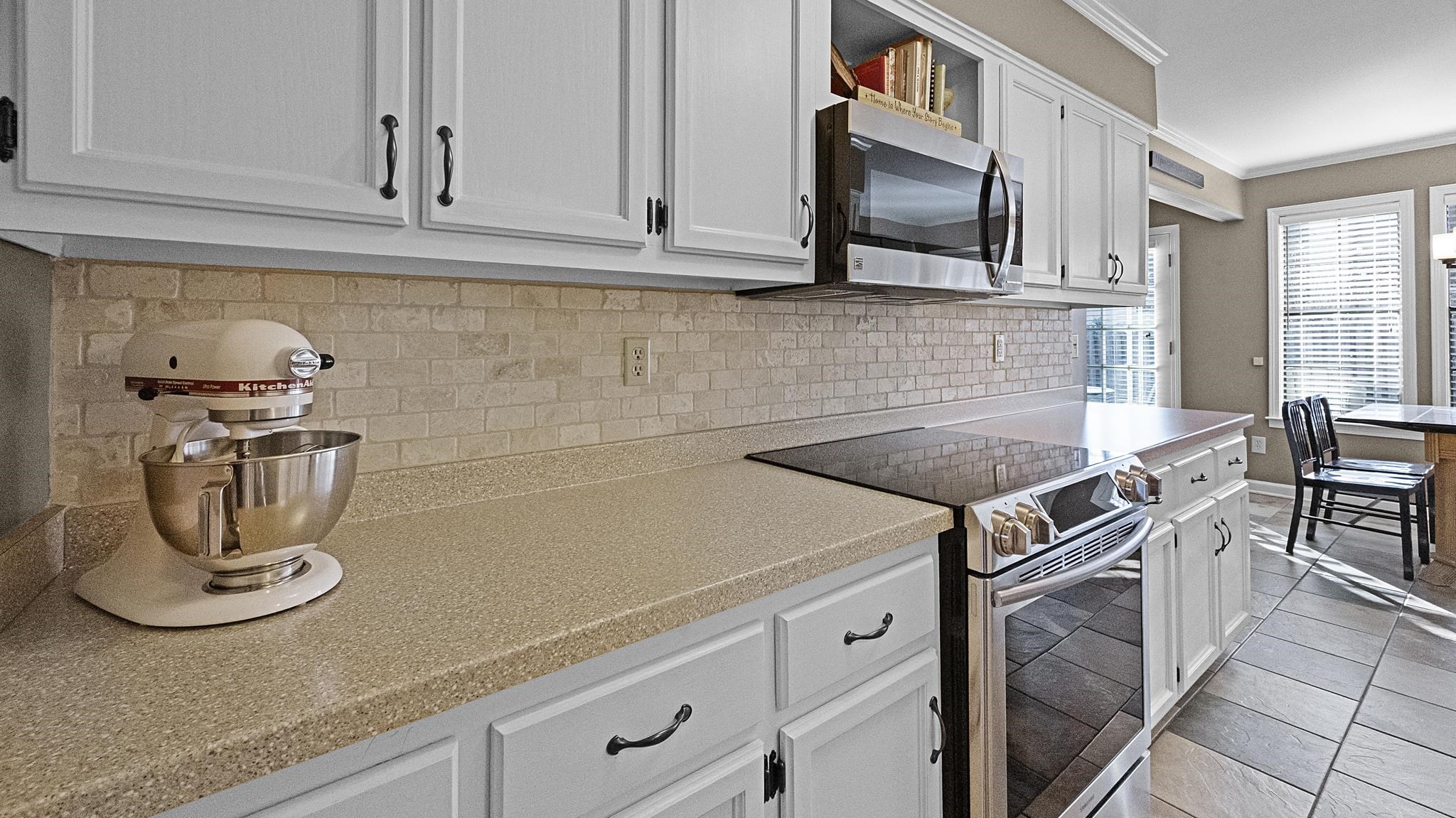 1883 Edwards Mill Road Germantown, TN 38139 - Photo 12 of 40 a kitchen with a sink and cabinets