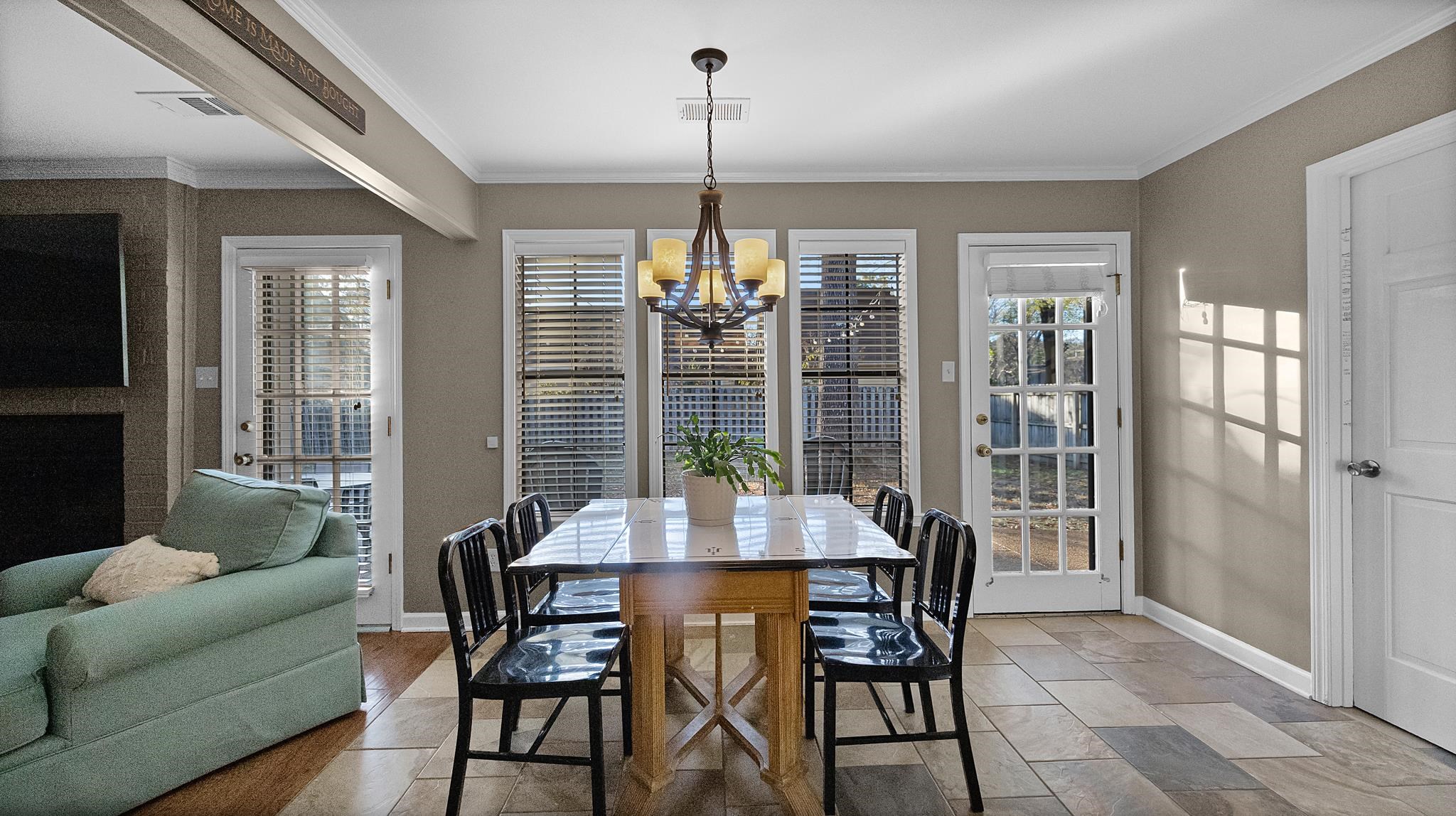 1883 Edwards Mill Road Germantown, TN 38139 - Photo 14 of 40 a view of a dining room with furniture window and wooden floor