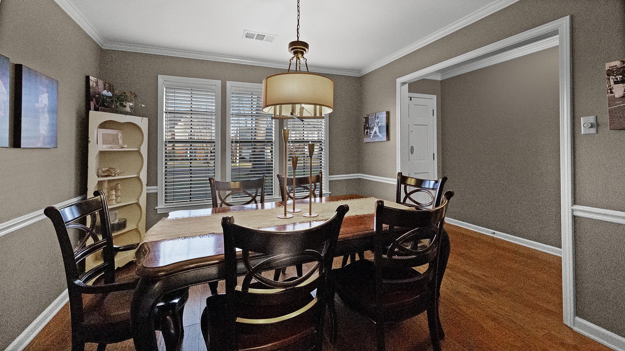 1883 Edwards Mill Road Germantown, TN 38139 - Photo 18 of 40 a view of a dining room with furniture window and wooden floor